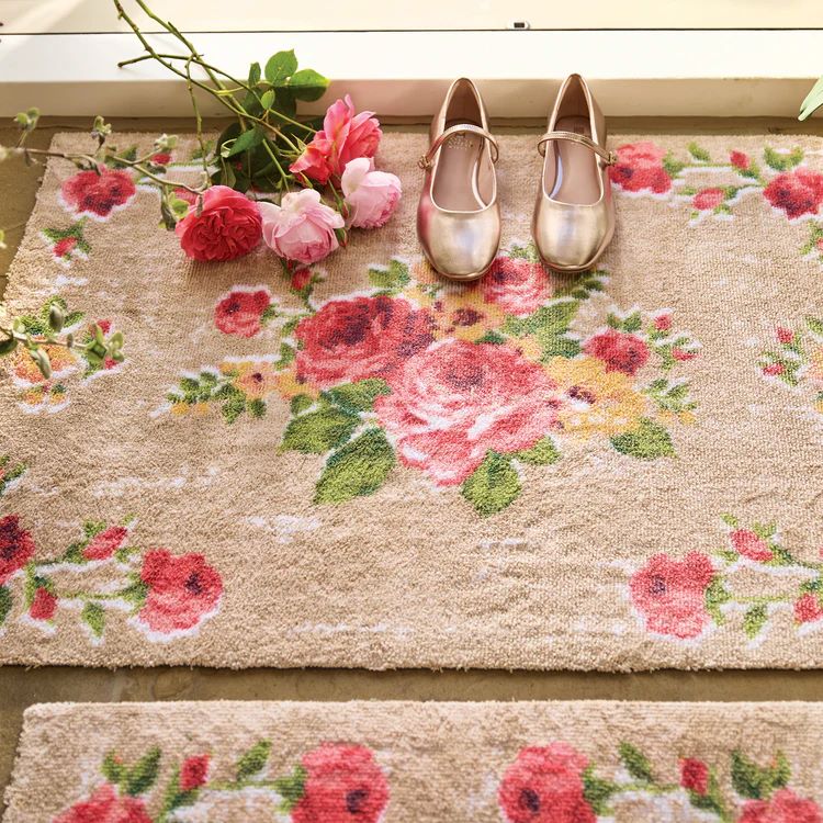 Hug Rug vintage rose design door mat with pink fresh roses and gold ballet pump shoes at doorway entrance
