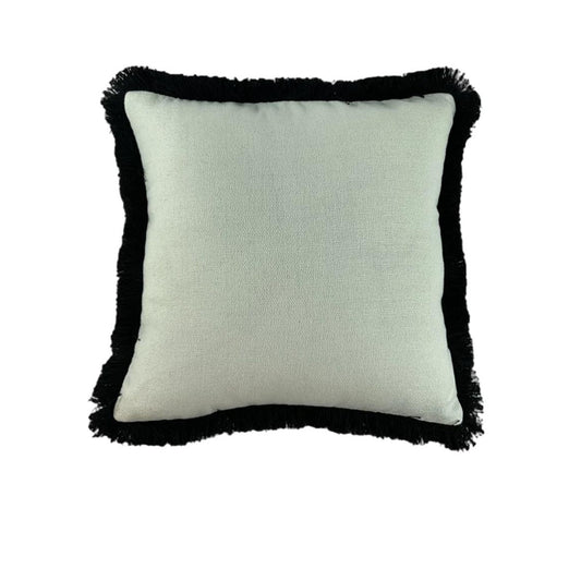 Square pillow with black fringe trim on a white background