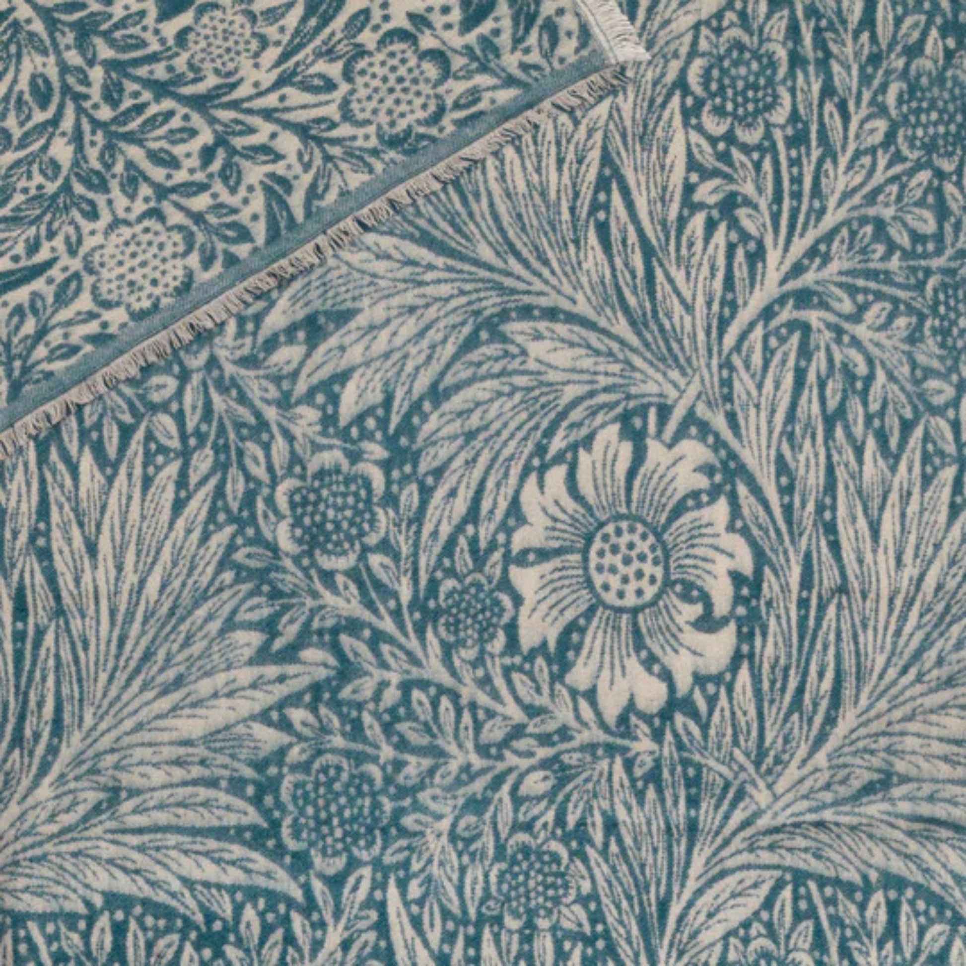 Floral and leaf pattern in blue on a matching fabric background