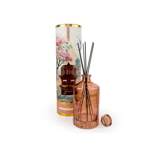 Decorative diffuser set with a bottle and cylindrical container on a white background