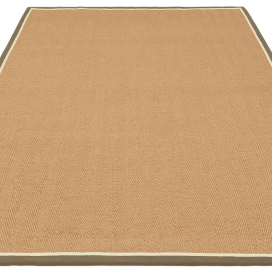 Beige rug with a subtle pattern on a white background