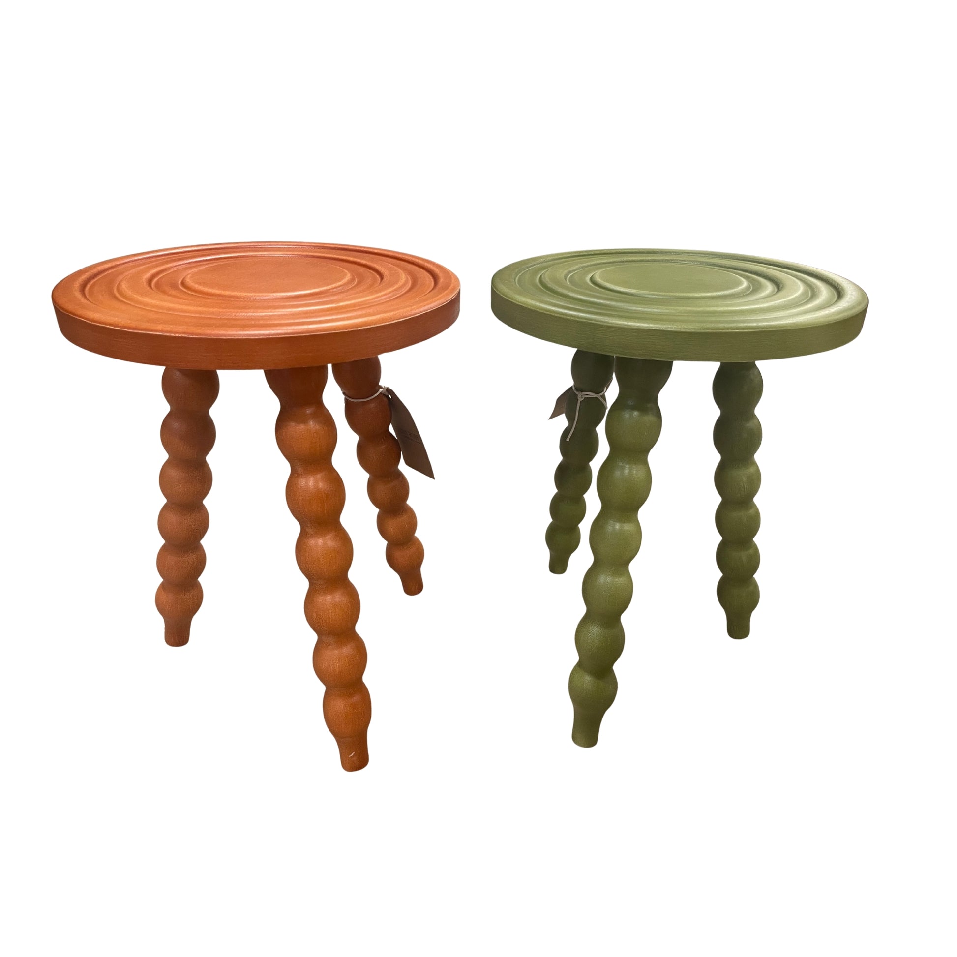 Two small round tables or stools with spiral legs, one orange and one green, on a white background