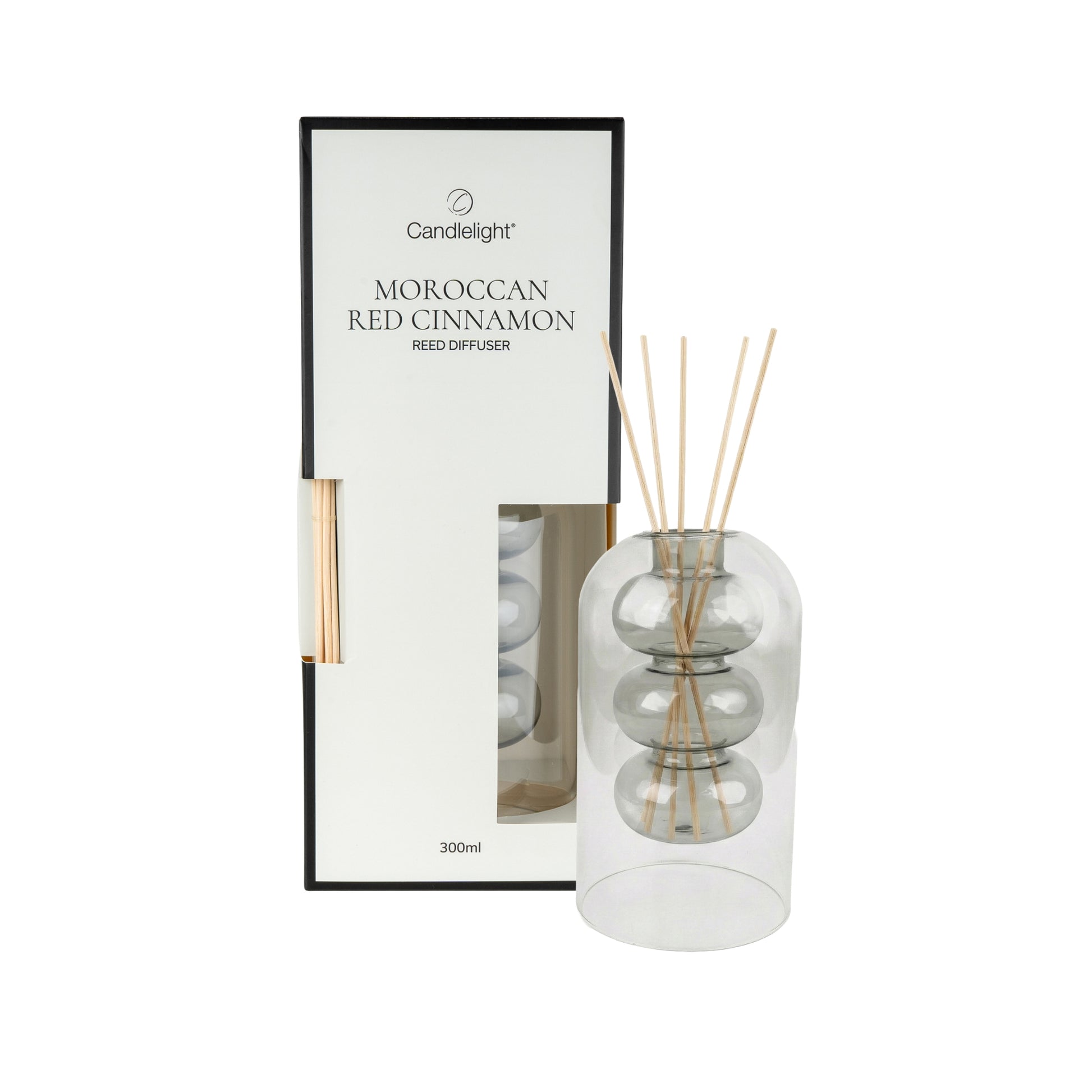 Candlelight Moroccan Red Cinnamon reed diffuser with packaging on a white background