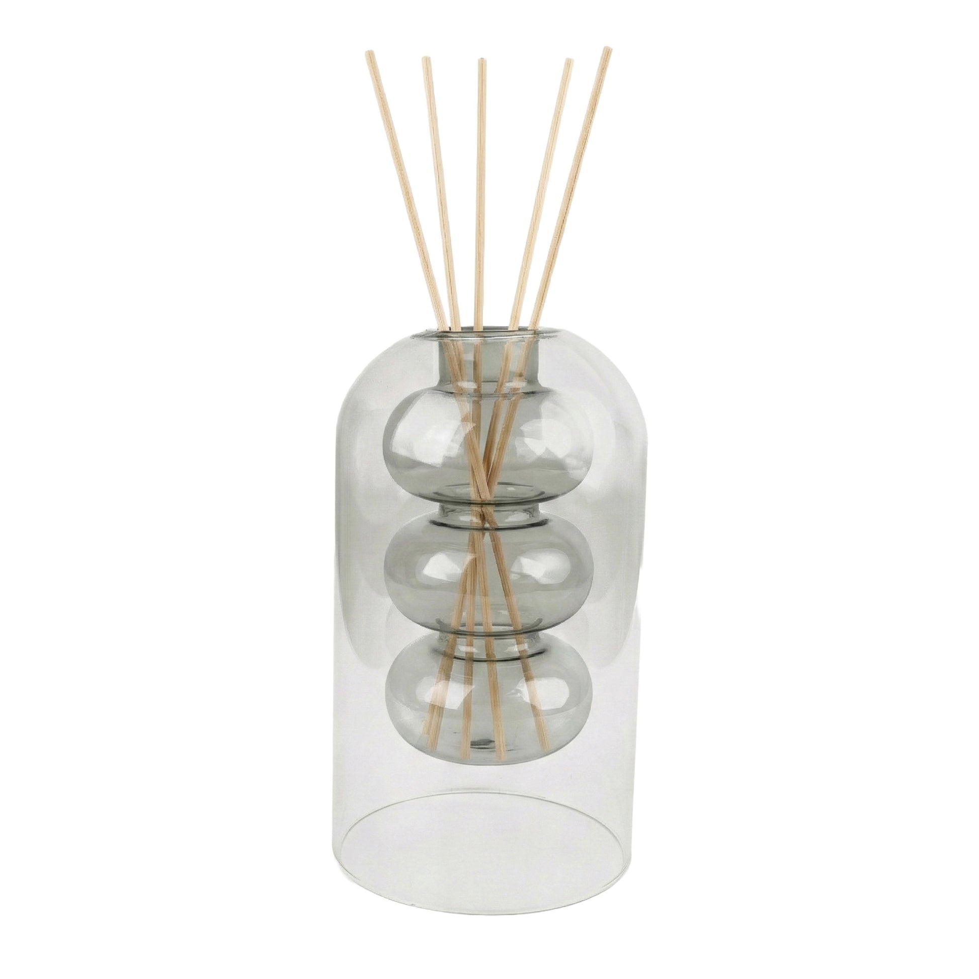 Clear glass diffuser with wooden sticks on a white background