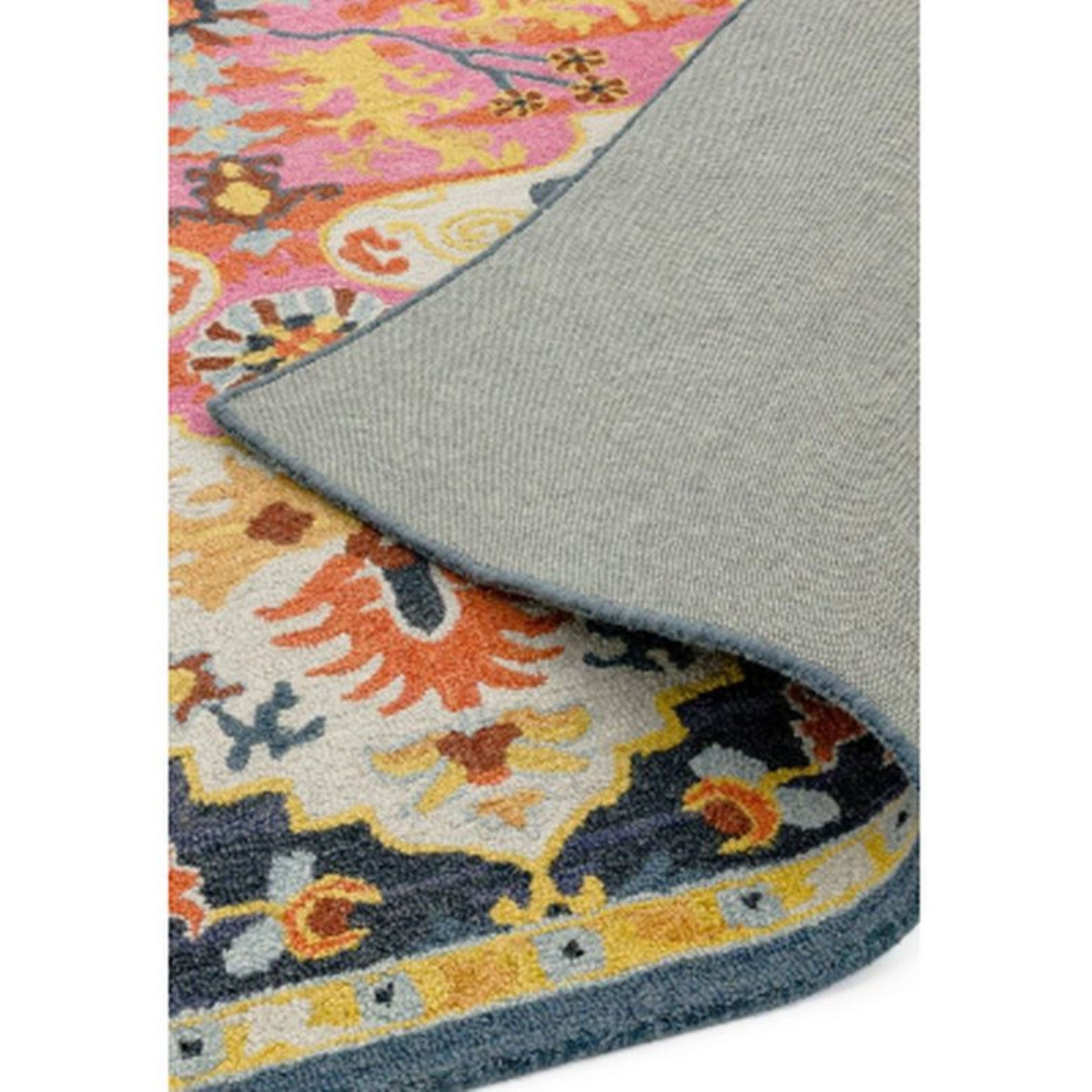 multicolour rug folded back at the corner 
