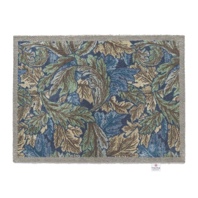 Hug Rug washable mat featuring a soft leaf design in light blue, green and beige tones