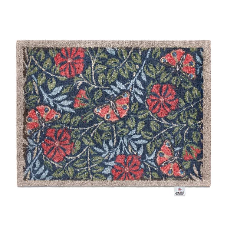 Hug Rug washable mat with a navy background and a red butterfly and red flower with green and light blue foliage pattern