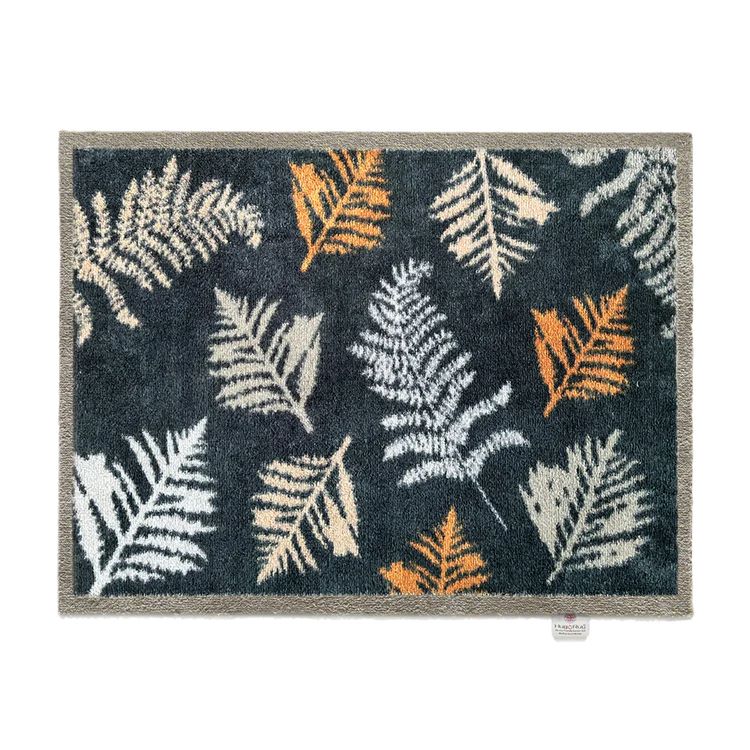 Hug Rug door mat with a dark navy background featuring autumn leaves design 