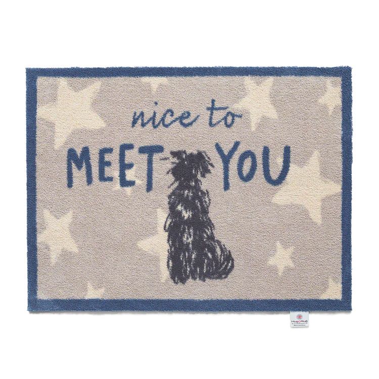 Hug rug washable doormat with a neutral background with light coloured star pattern featuring a blue border and the text Nice To Meet and a silhouette of a black dog sitting in the centre