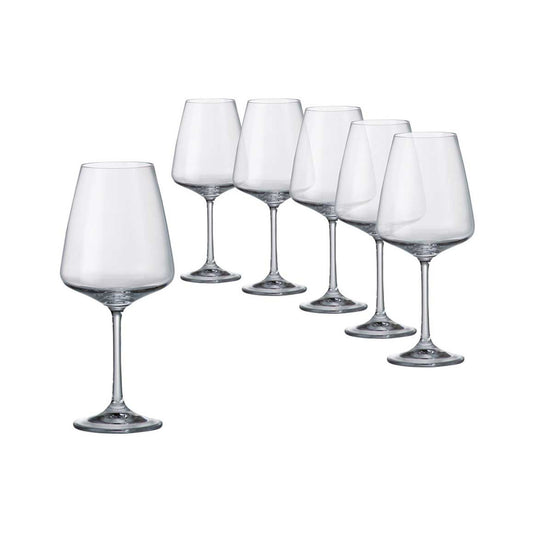 Set of six clear wine glasses on a white background