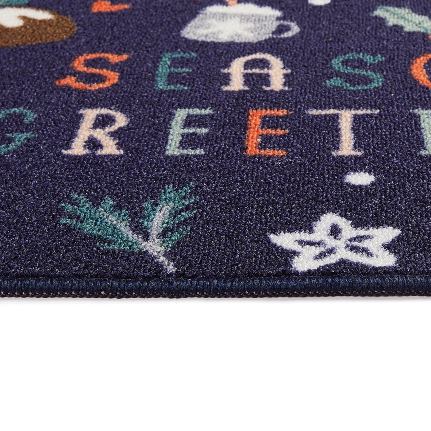 Navy rug with 'Season's Greetings' text and festive illustrations on a white background