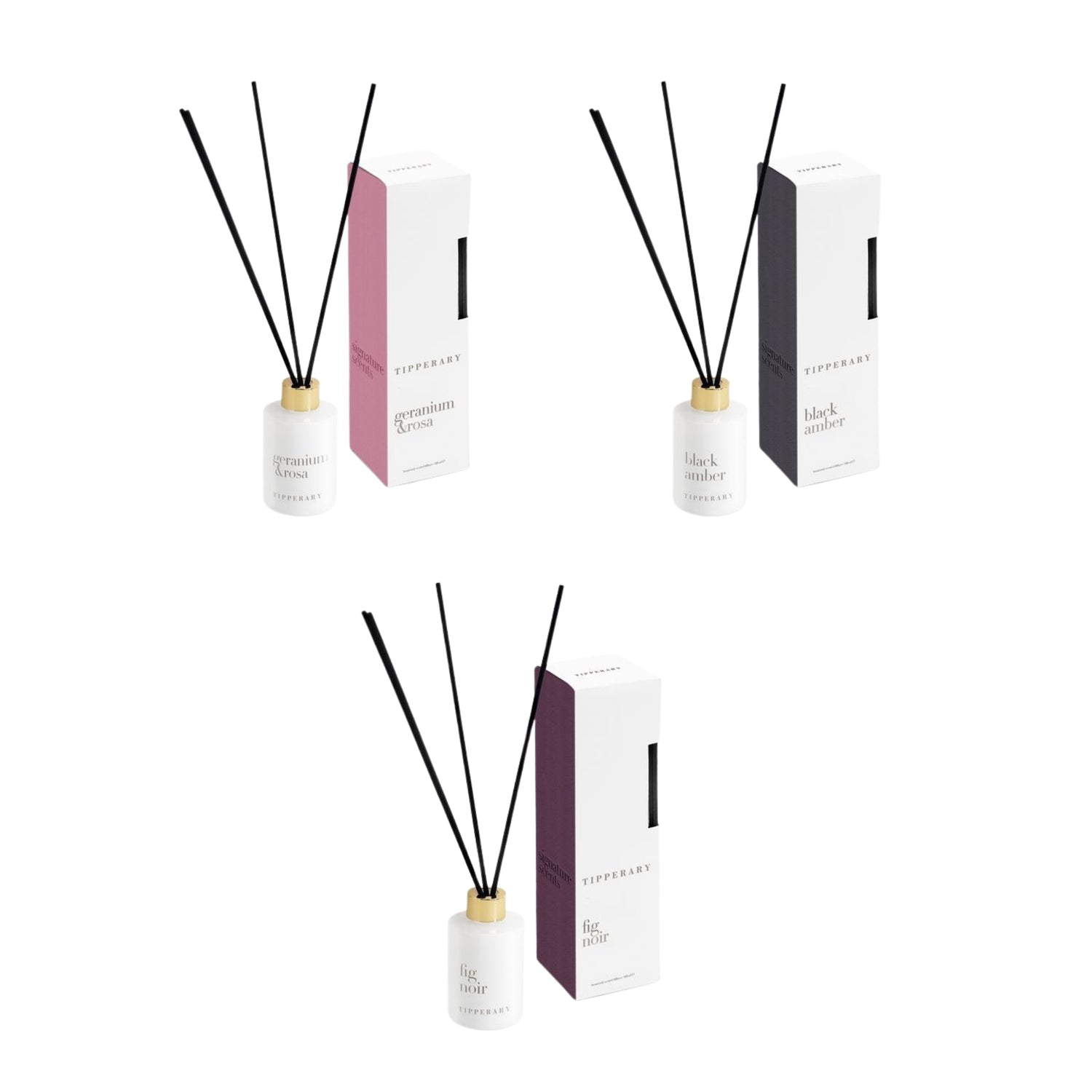 Three diffuser sets with reeds and boxes on a white background