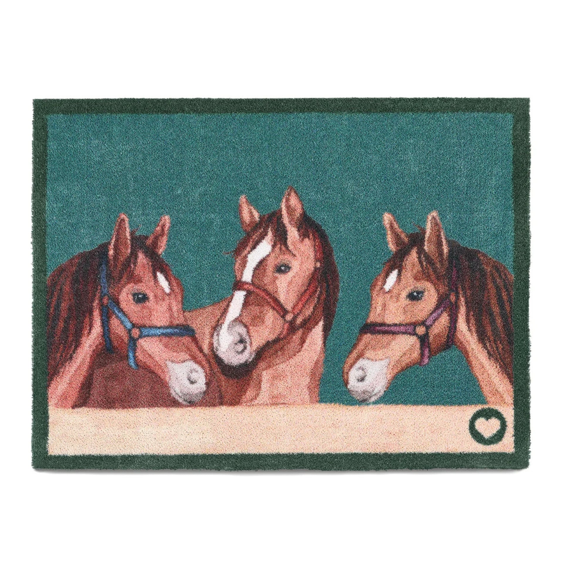 Doormat with three horses on a green background