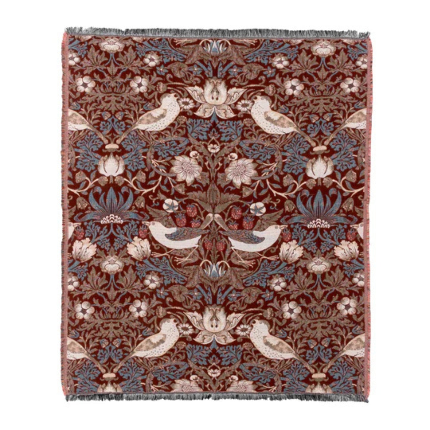 Decorative throw with floral and bird pattern on a plain background