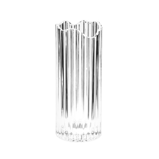 Glass vase with scalloped top on a white background