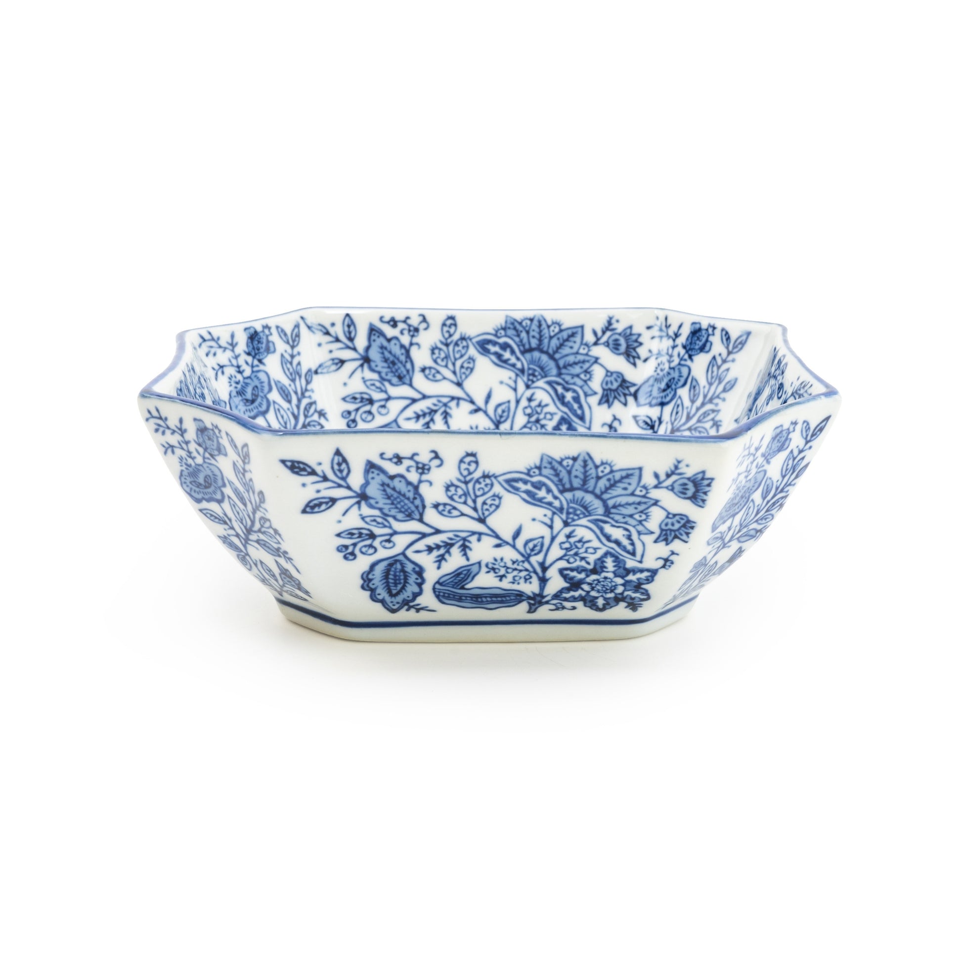 Decorative white bowl with blue floral patterns on a white background