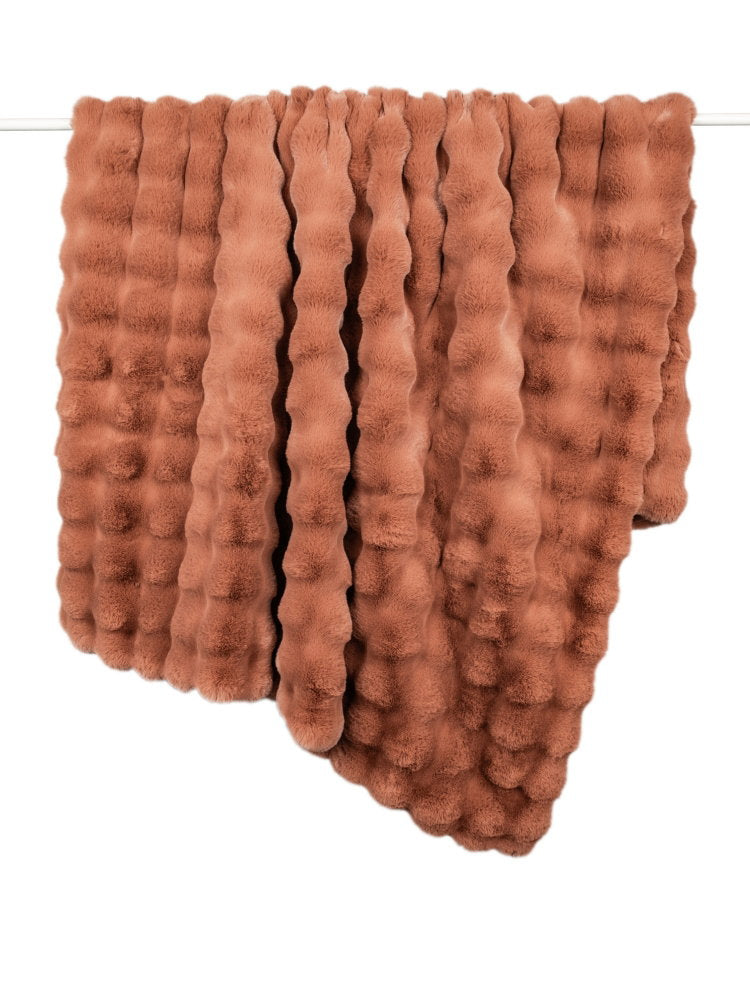 Raffles Orange Faux Fur Throw draped