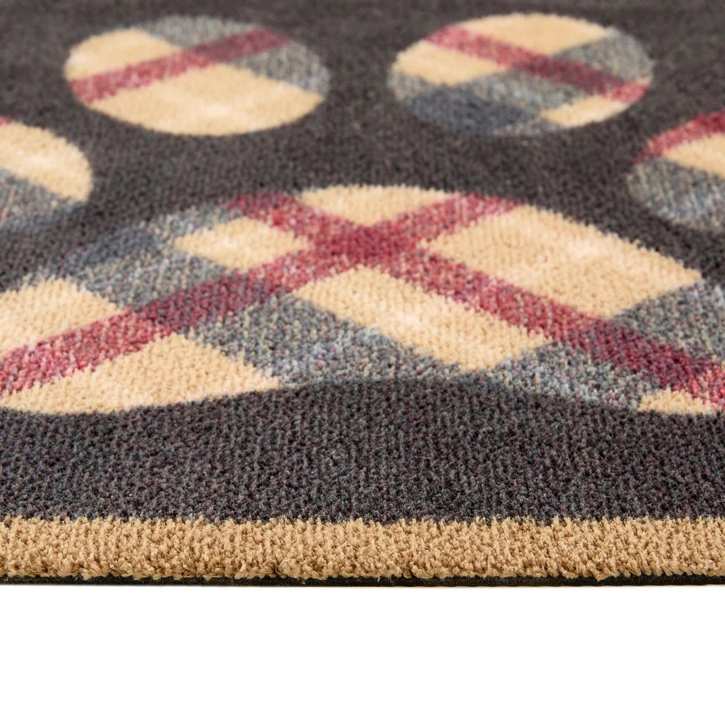 Close-up of a textured rug with geometric pattern