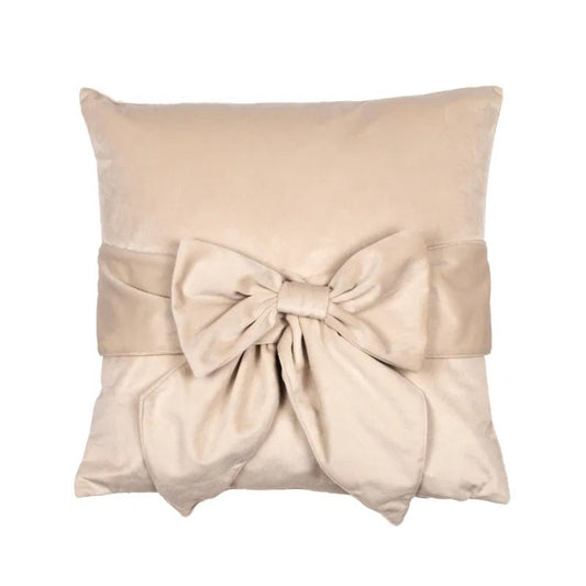 A beige velvet cushion with a tied up bow in the center.