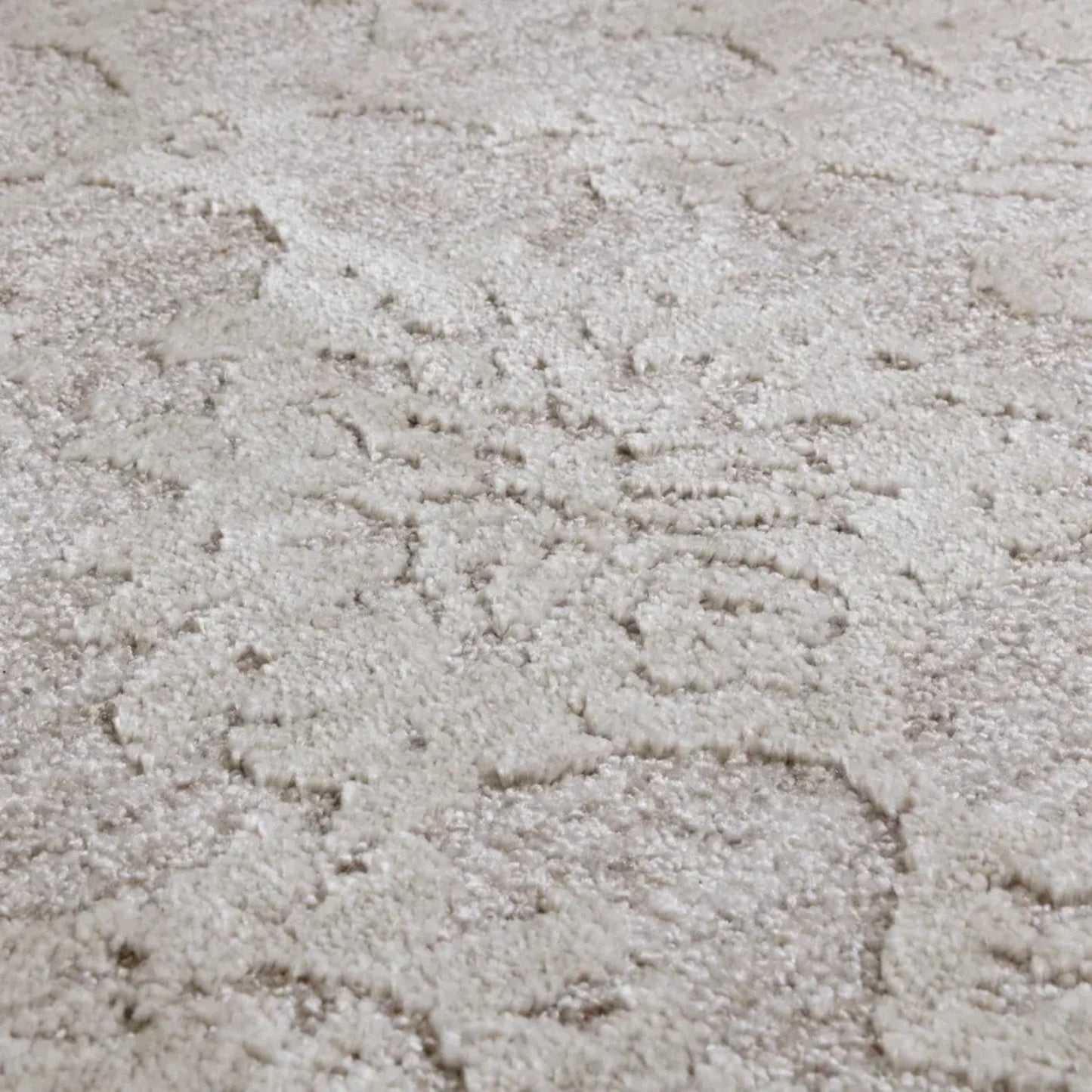 Close-up of textured beige rug