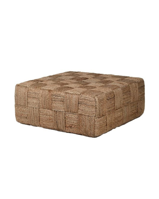 A square woven pouf ottoman in a natural jute or seagrass material, featuring a textured basketweave pattern in shades of brown and beige, isolated on a white background.