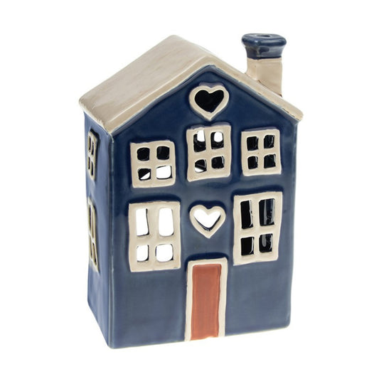 Ceramic house-shaped tea light  lantern with heart designs on a white background