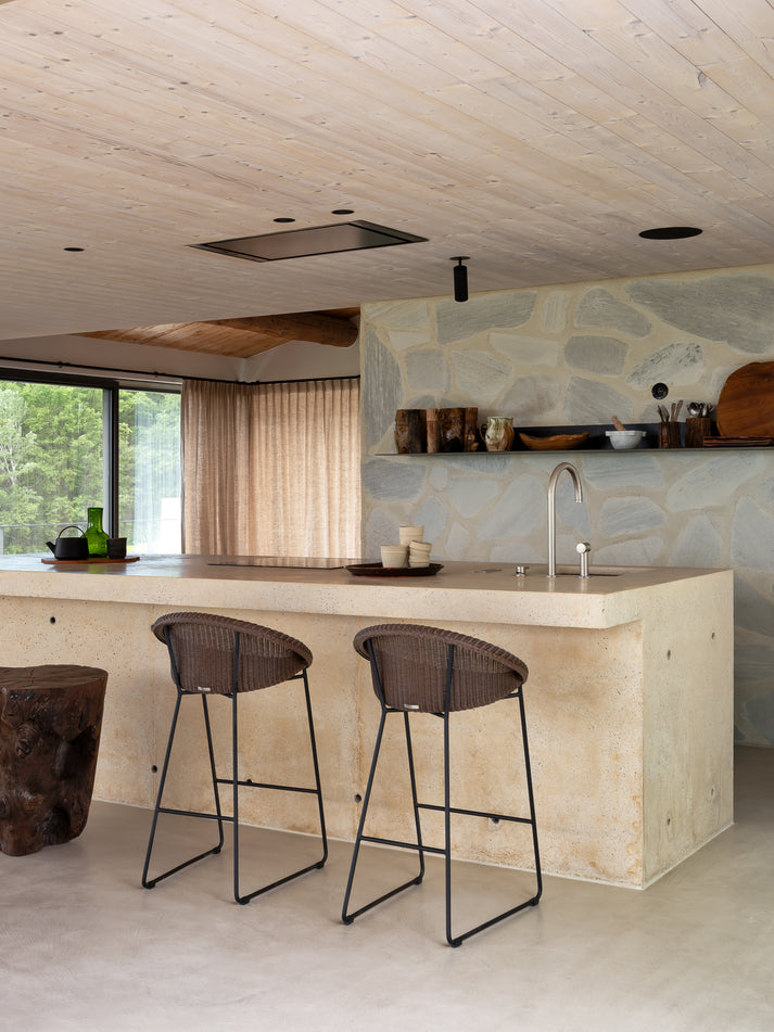 The Joe counter stool with it is sleek sled base is loved by many because of its versatile design. The delicately woven seat adds a warm touch to any interior while the steel base gives the stool a more contemporary look.undefined