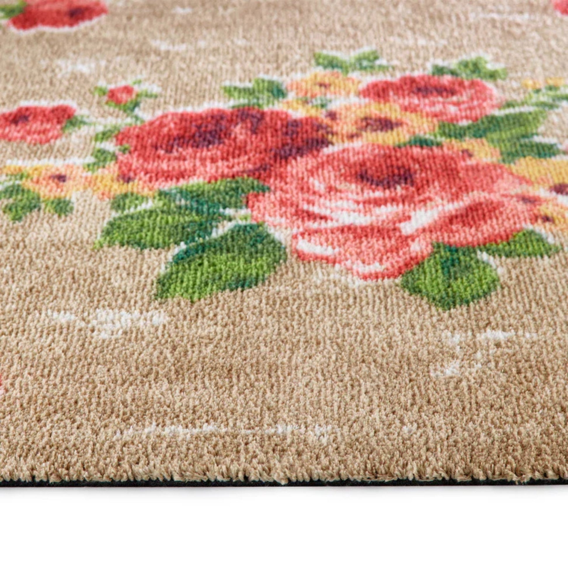 Floral patterned rug with pink roses on a beige background