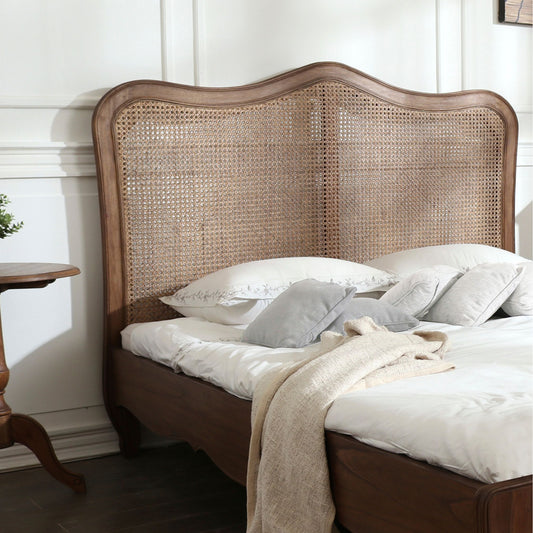 Rattan headboard detail of walnut king size bed frame