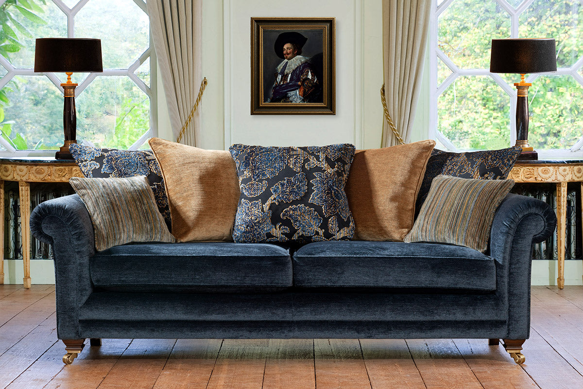 Charlbury Grand Sofa, pillow back, antique/brushed brass castor legs