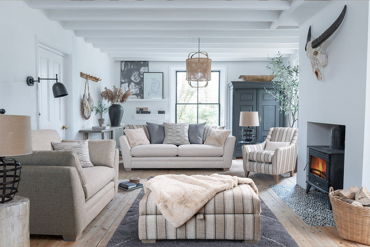 Rochelle Grand Sofa in room setting with Snuggler, Accent Chair and Ottoman