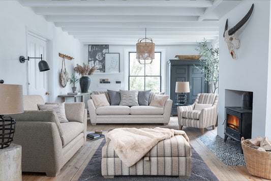Rochelle Snuggler in room setting with Grand Sofa, Accent Chair and Ottoman