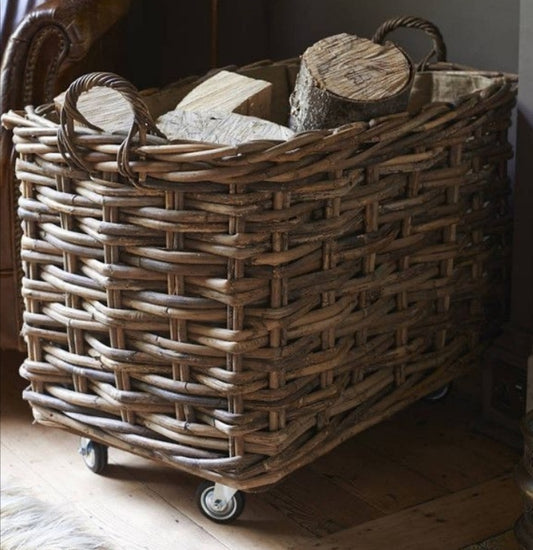 Rectangle Log Basket full of logs in the corner of a room next to a leather armchair 