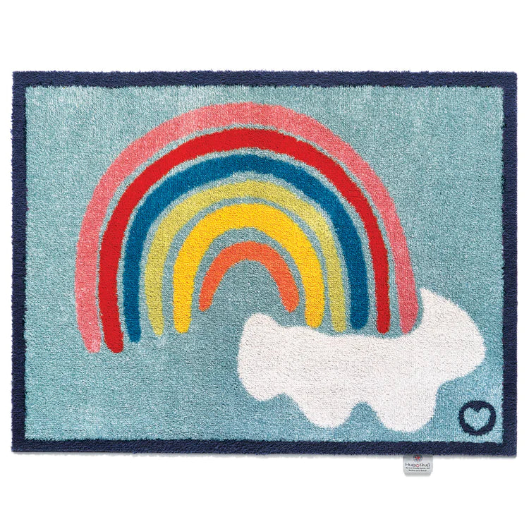 Hug Rug washable door mat with colourful rainbow and cloud design on a light blue background