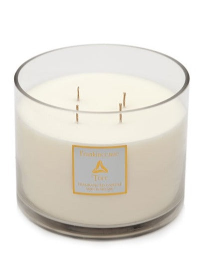 torc 4 wick white candle in a clear glass round container on a white background 